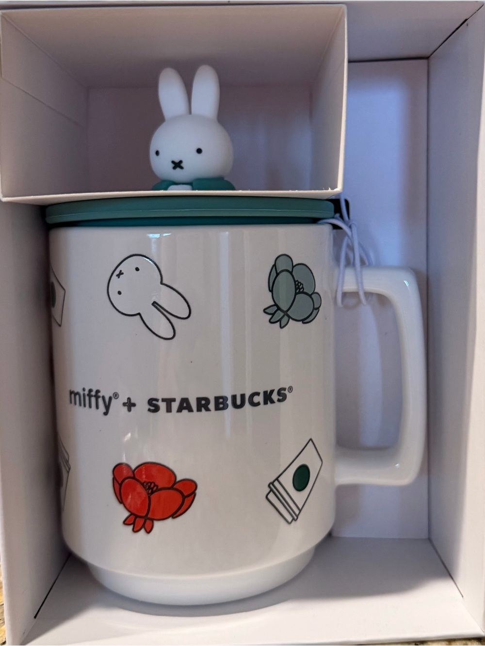 Starbucks White Mug with Teal Lid and Red Floral Accents featuring Bunny Topper